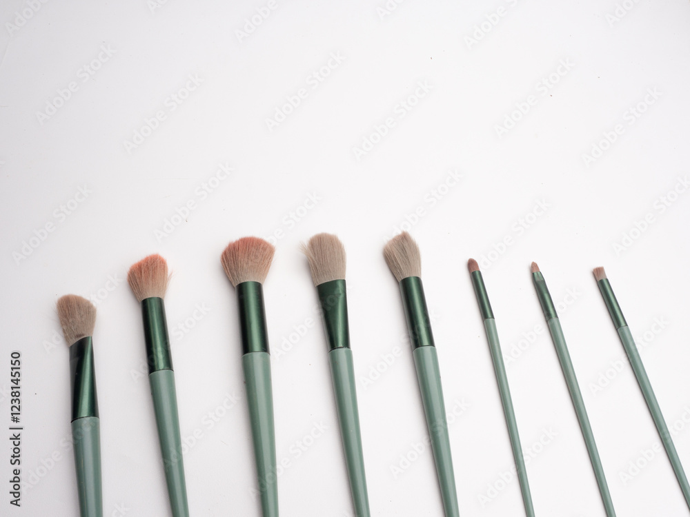 Set brush for cosmetics with green theme is isolated on a white background, Professional makeup brush made of natural pile green theme on a white background Set brush for cosmetics with green theme is isolated on a white background, Professional makeup brush made of natural pile green theme on a white background
