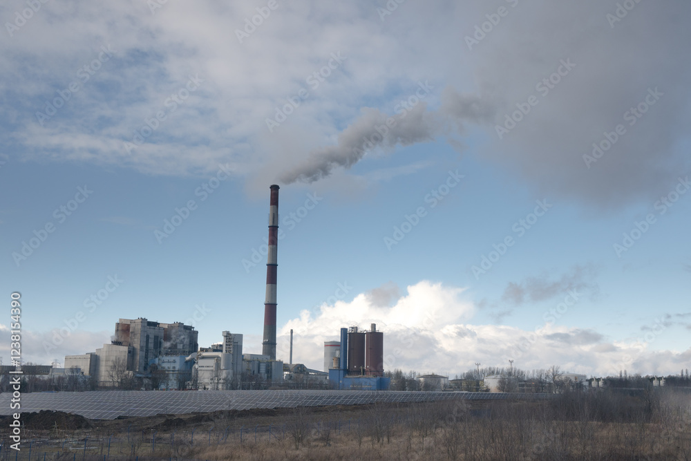 A coal-fired power plant emits greenhouse gases into the atmosphere.