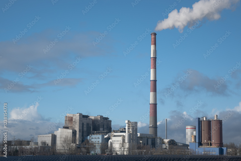 A coal-fired power plant emits greenhouse gases into the atmosphere.