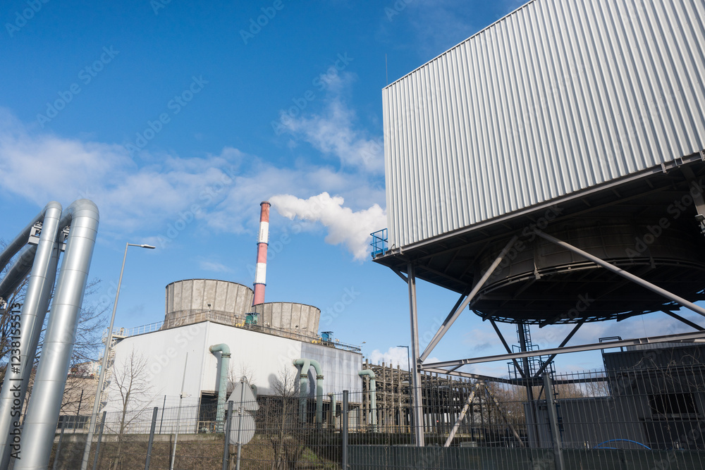 A coal-fired power plant emits greenhouse gases into the atmosphere.