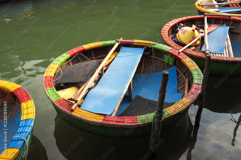 Obraz premium Round basket boats, woven from bamboo, are used to transport tourists in Cam Thanh nipa palm forest, Hoi An, Vietnam 