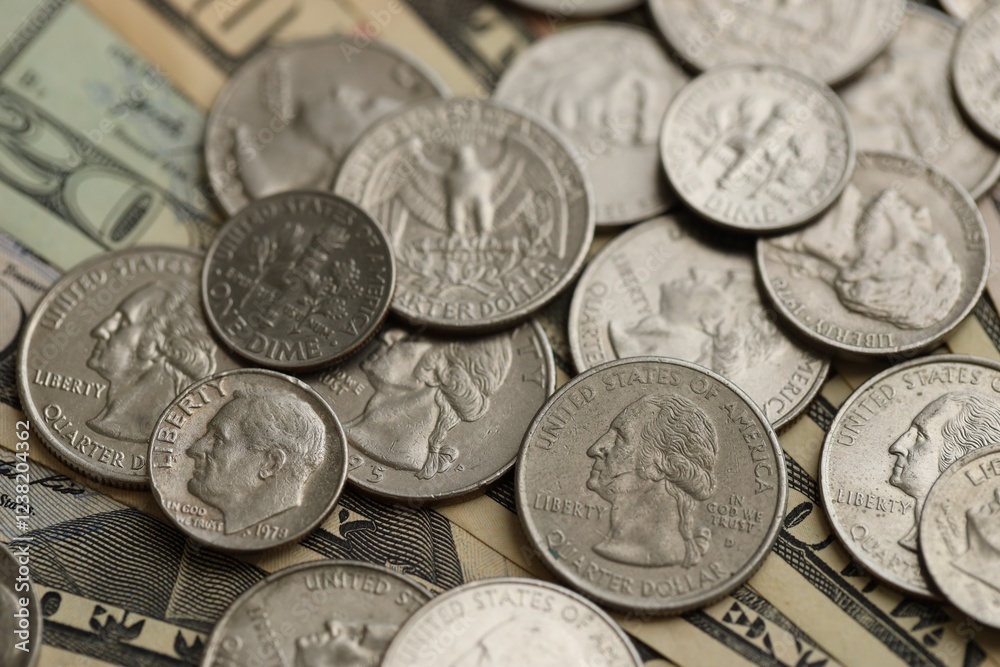 Many different dollar bills and silver cent coins under natural light Many different dollar bills and silver cent coins under natural light