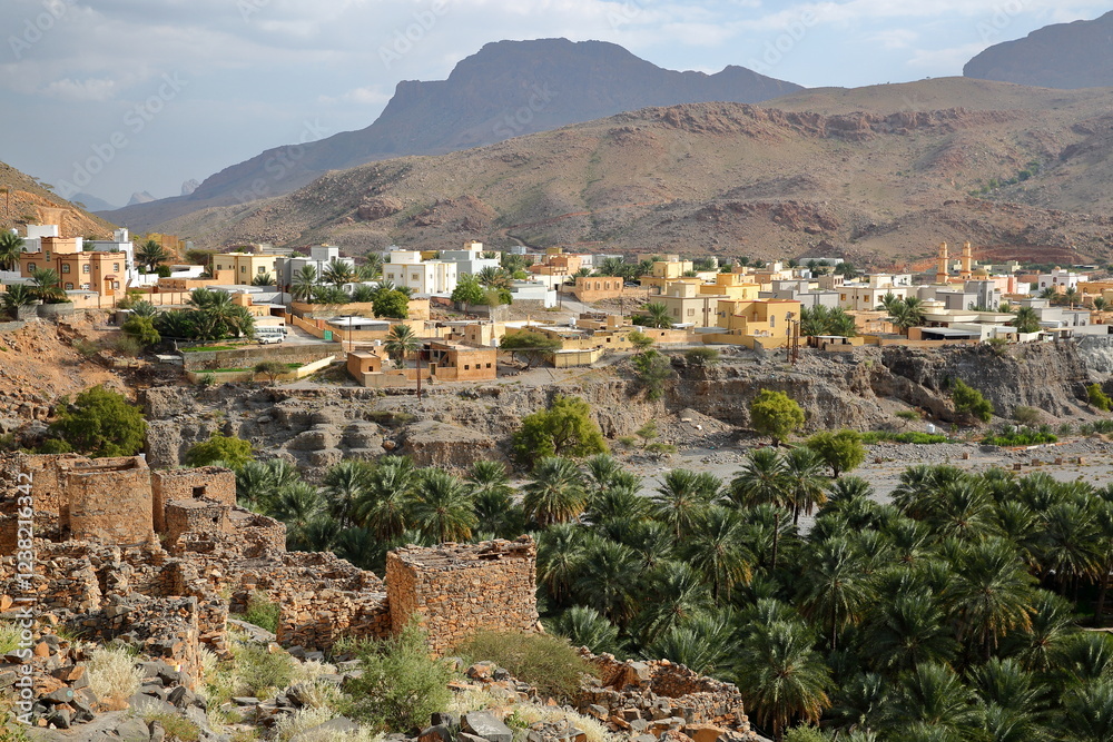 Ghul village, located 12 km west of Al Hamra and on the road to Jebel Shams, Al Dakhiliyah, Oman, with the ruins of the abandoned old Ghul village in the foreground
