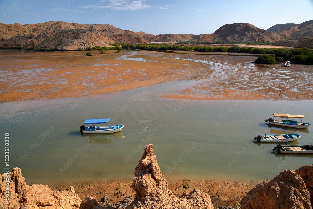 The Fjords of Bandar Al Khairan, located 30 km East from Muscat, Oman, with desert landscape, clear and colorful water, beaches and rocky mountains