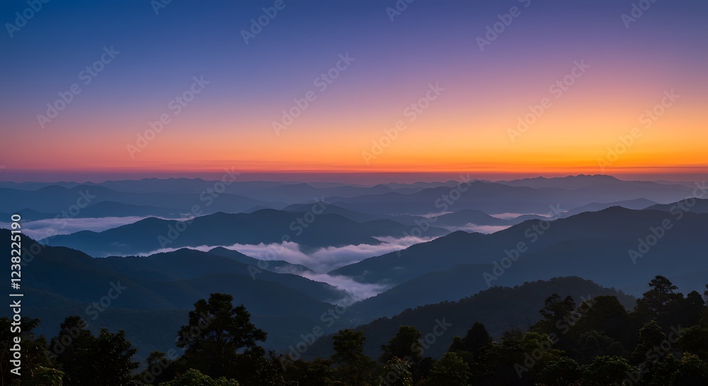 Naklejka premium Stunning Sunset Over Misty Mountain Ranges Landscape