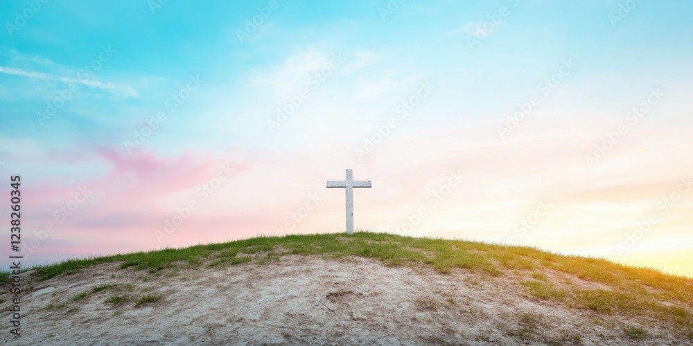 A white cross is on a hillside with a beautiful blue sky in the background. Concept of peace and serenity, as the cross stands alone on the grassy hill A white cross is on a hillside with a beautiful blue sky in the background. Concept of peace and serenity, as the cross stands alone on the grassy hill