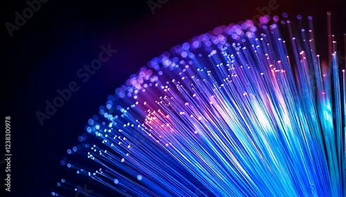 Fiber optic cable glowing in blue and purple hues, with sharp light trails and a blurred background, leaving space for text overlay
