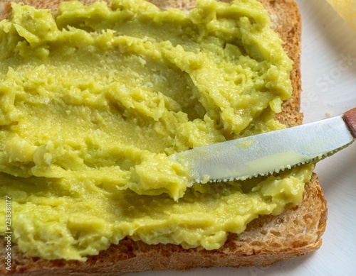 Spreading Avocado on Toast with a Butter Knife photo