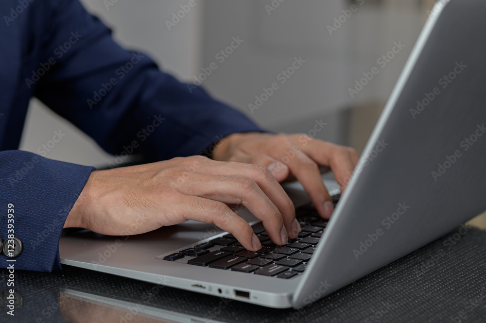 Professional Hands Typing on Laptop Keyboard in Modern Office Setting Professional Hands Typing on Laptop Keyboard in Modern Office Setting