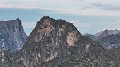 Sunlight illuminating ergaki natural park mountain peaks