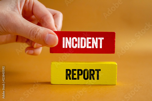 Incident report message written on wooden blocks on brown background. Conceptual incident report symbol. Copy space.