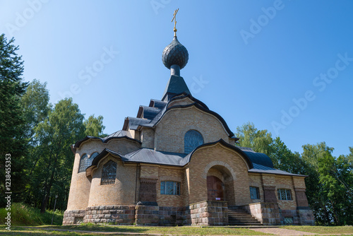 The ancient Church of the Holy Spirit on a sunny July day. Flenovo, Smolensk Region photo