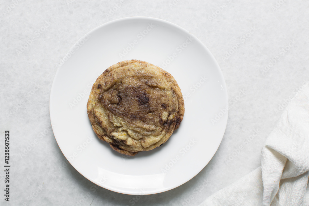 Overhead view of cinnamon cookies, top view of cinnamon vanilla cookies, process of making bakery style cookies Overhead view of cinnamon cookies, top view of cinnamon vanilla cookies, process of making bakery style cookies