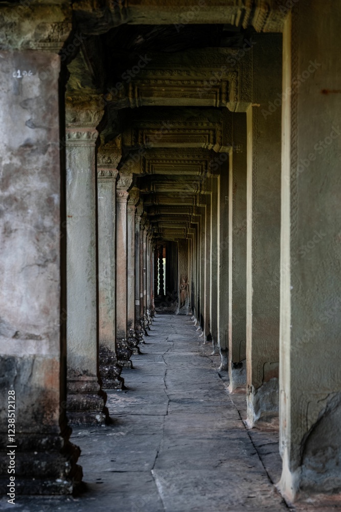 Fototapeta premium Historic stone corridor at Angkor Wat, Cambodia.