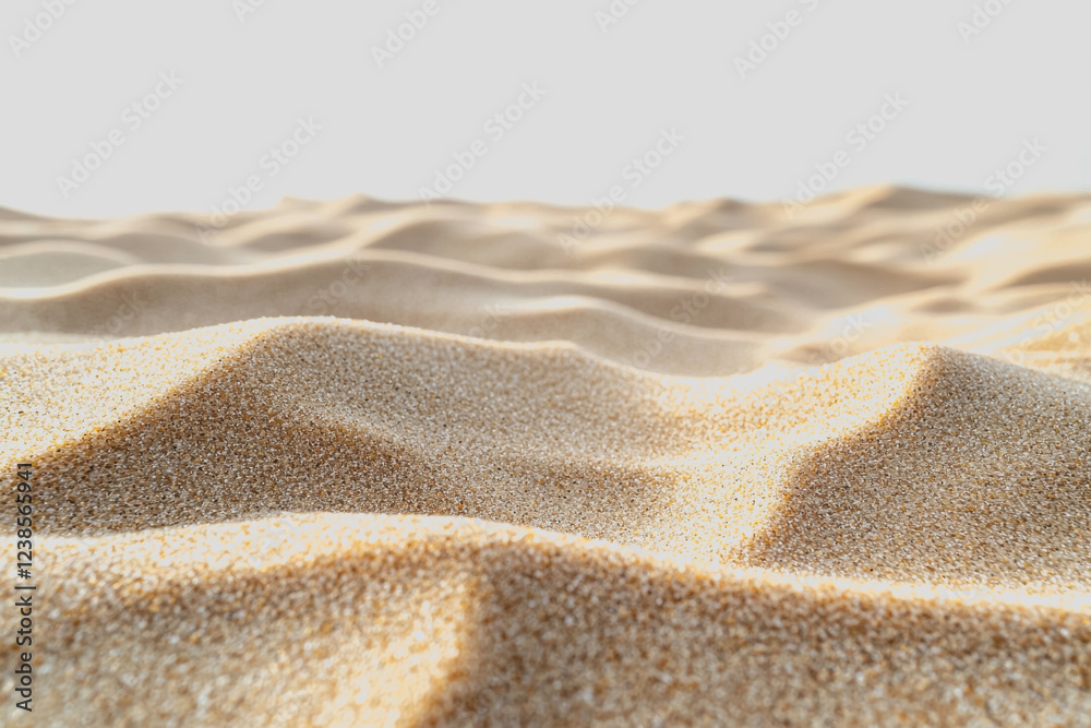 Close up view of fine sand grains on a sunny beach with gentle waves lapping against the shore creating a serene coastal landscape