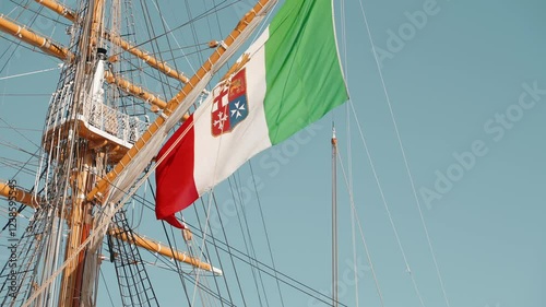 naval ensign of Italy on sailboat mast