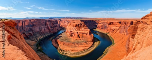 River canyon nature idea. Breathtaking view of Horseshoe Bend with vibrant red rock formations and blue river. photo