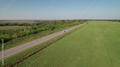 Aerial view of car driving. Road trip. 