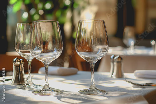 Wallpaper Mural Table set with two wine glasses and a bottle of wine ready for a romantic dinner or celebration in an elegant setting with soft lighting Torontodigital.ca