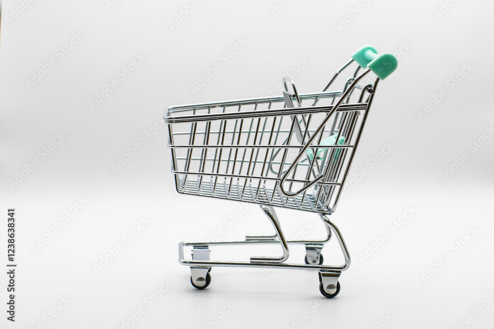 Empty cart from a store or supermarket. metal and chrome. isolated background. close-up. Element for design. Empty cart from a store or supermarket. metal and chrome. isolated background. close-up. Element for design.