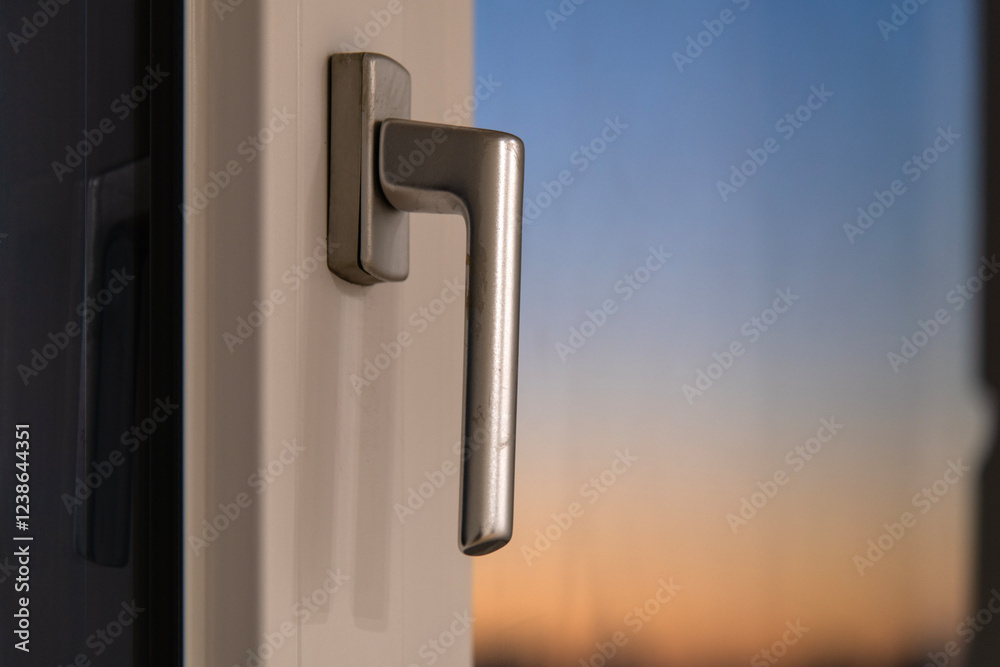 View of the window handle during sunset View of the window handle during sunset