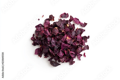 Dried Urfa biber chili flakes in dark purple color, isolated on white background, culinary spice photo