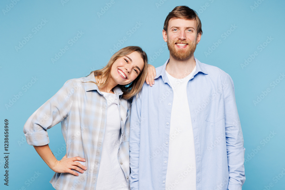 Young couple two friends family man woman wears shirt casual clothes together put head on shoulder look camera isolated on pastel plain light blue cyan background studio portrait. Lifestyle concept. Young couple two friends family man woman wears shirt casual clothes together put head on shoulder look camera isolated on pastel plain light blue cyan background studio portrait. Lifestyle concept.