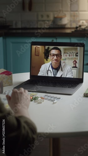 A patient consults with an online doctor from home while reviewing medical test results. Ideal for themes of telemedicine, digital healthcare, remote diagnosis, and virtual medical consultations