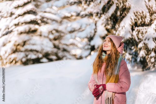 Obraz na płótnie Smiling Woman Enjoying Walk in Winter Forest w salonie