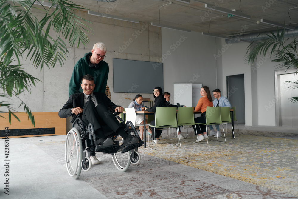 Obraz premium Employee Entertaining Director in a Wheelchair While Rolling Through the Office with Laughter and Joy.