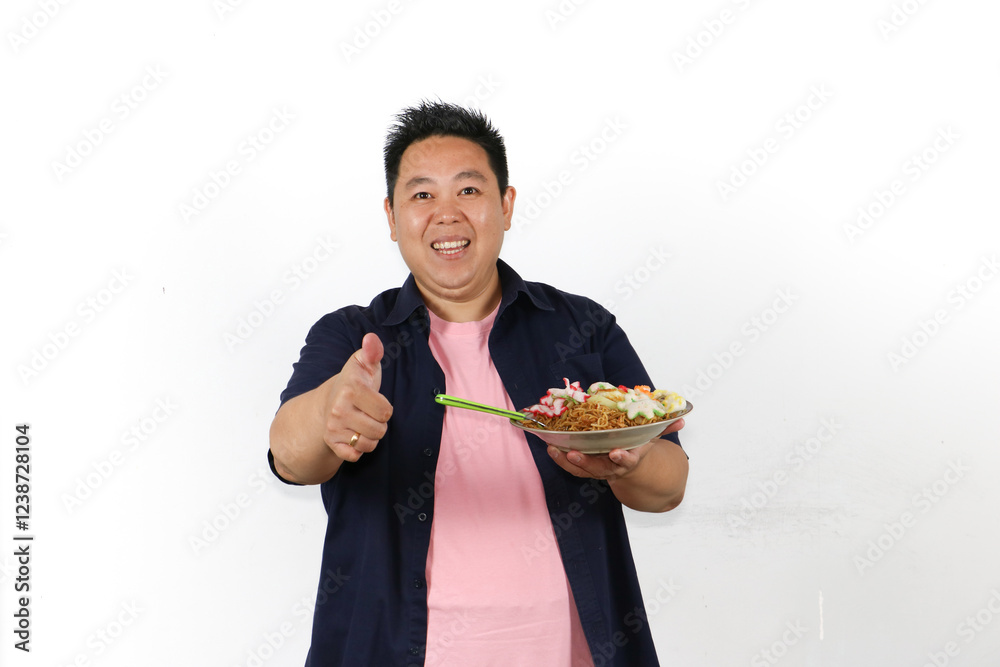 Man enjoying a delicious meal and thumbs up over isolated white background Man enjoying a delicious meal and thumbs up over isolated white background