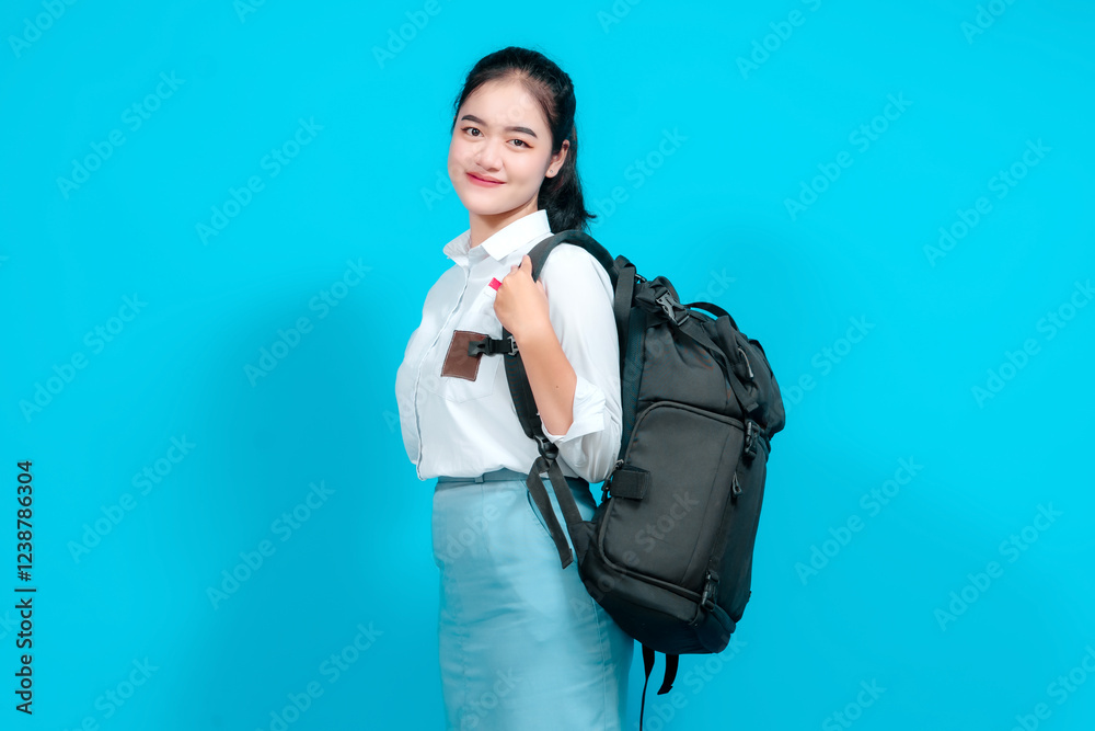 Portrait female student dressed in a uniform, displays a surprised expression, her hands on her cheeks Portrait female student dressed in a uniform, displays a surprised expression, her hands on her cheeks