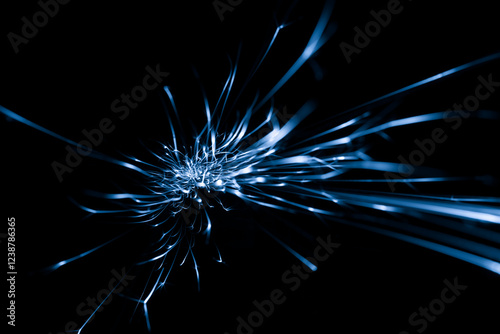 blue sparks from the grinder glowing in the dark