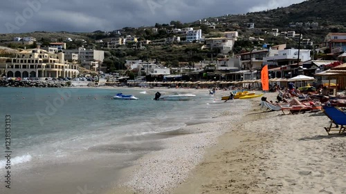 Panning left from the beach at luxury hotel to the sea, Crete, Greece