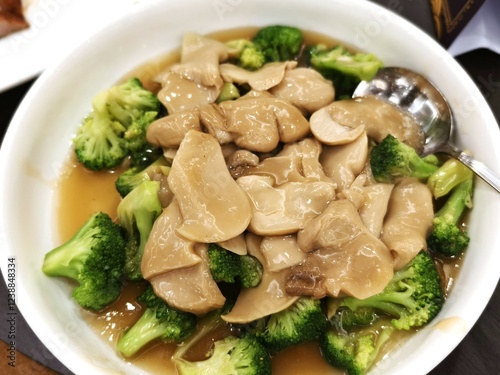 A serving of healthy and nutritious Asian cuisine with broccoli and Bai Ling mushrooms