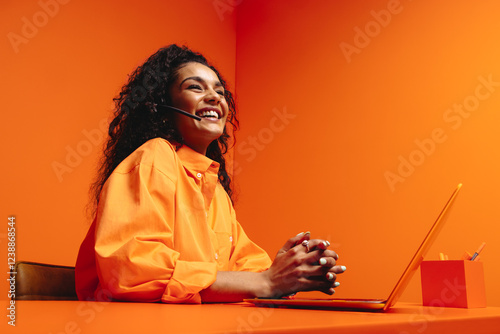 Smiling virtual assistant in vibrant, colorful office setting emphasizing creativity and modernity