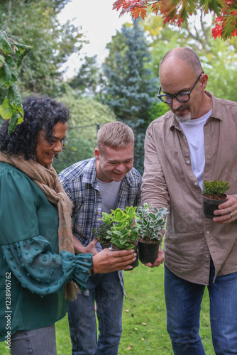 Wallpaper Mural Family with adult son looking at plants in garden Torontodigital.ca