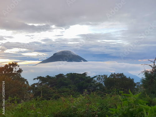 Wallpaper Mural Majestic Mountain Peak Rising Above Clouds at Bukit Sikunir, Dieng, Central Java. A Serene Landscape View with Lush Greenery, Tranquil Atmosphere, and Breathtaking Panorama Torontodigital.ca