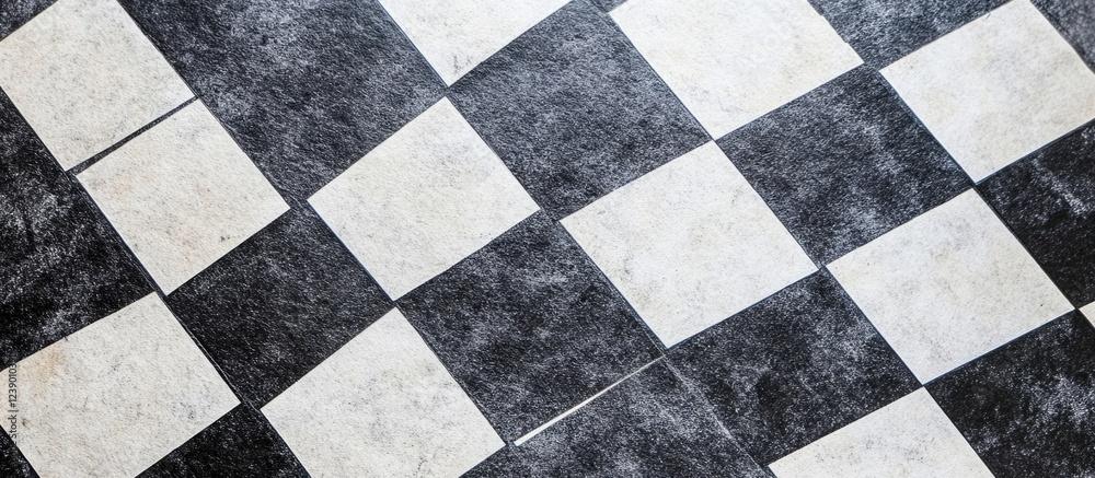 Black and white checkerboard floor tiles with a textured surface and visible grout lines Copy Space Black and white checkerboard floor tiles with a textured surface and visible grout lines Copy Space