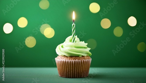 unmarried birthday cupcake with candle on inexperienced