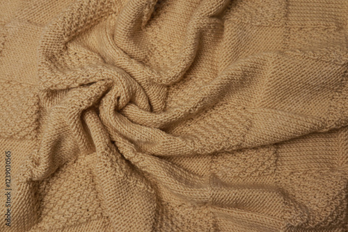 Knitted plaid for baby on light background