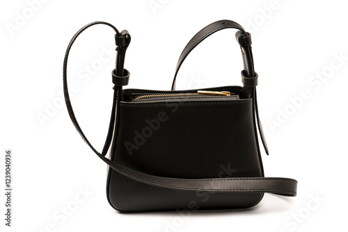 Black small leather cross body bag isolated on a white background.