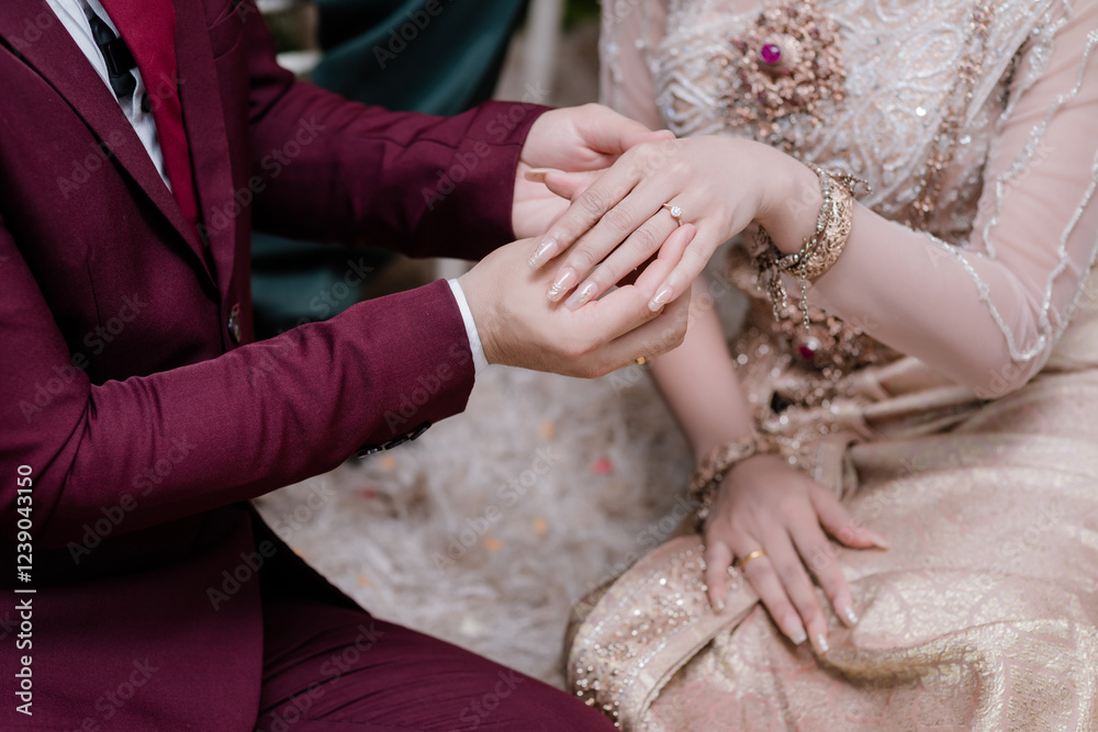 Close up hand groom wear wedding rings to left finger of bride, Wedding Poster, invitation card, copy space .
Close up hand groom wear wedding rings to left finger of bride, Wedding Poster, invitation card, copy space .