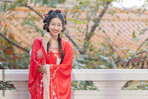 Asian woman in traditional Chinese red attire for Chinese New Year