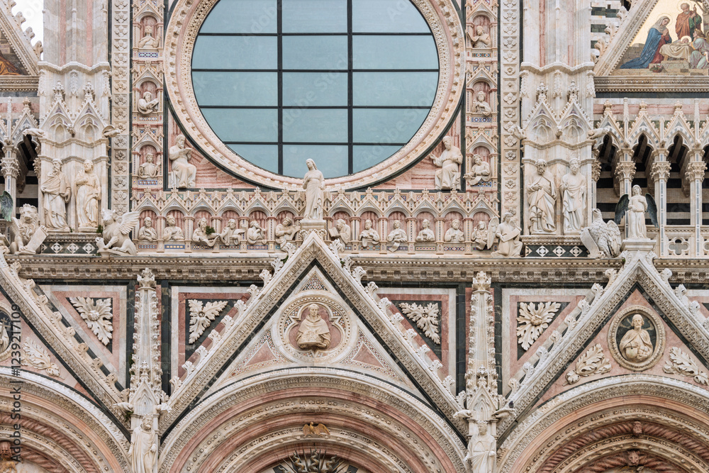 Obraz premium Facade of the Siena Cathedral. It's a medieval church dedicated from its earliest days as Roman Catholic Marian church. The cathedral was completed in 1263. Italy, 2019