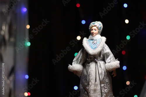 Snow maiden on a dark background with colored lanterns, christmas tree toys, Christmas tree rain