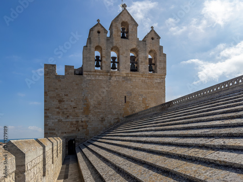 The bell tower of the Church of the Saintes Maries de la Mer , a Romanesque fortified church built in the 9th century in Saintes-Maries-de-la-Mer in Camargue photo