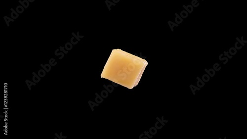 Cube of mango rotating. Sweet yellow fresh piece of mango isolated close up spinning with chromakey background, alpha channel