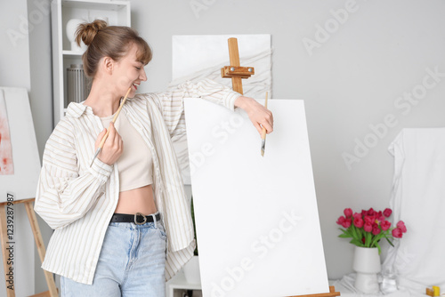 Smiling young woman artist ...