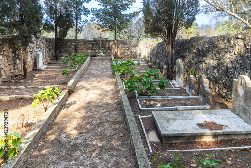 Mount Tabor, Israel – February 3, 2025: Monastery cemetery near the Church of the Transfiguration at the summit. photo